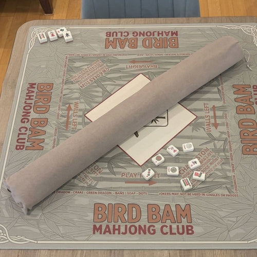 Durable heather gray fabric storage bag tailored to keep rollable mahjong playmats clean and dust-free.
